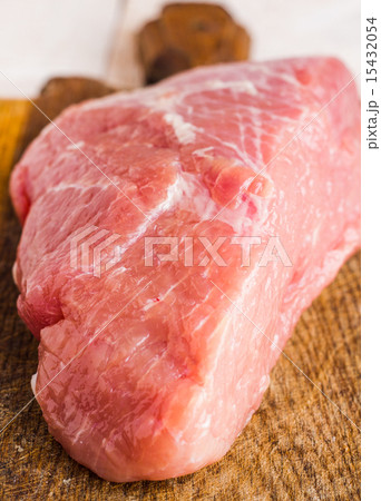 raw meat on a cutting board on a white background 15432054