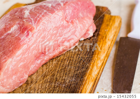 raw meat on a cutting board on a white background 15432055