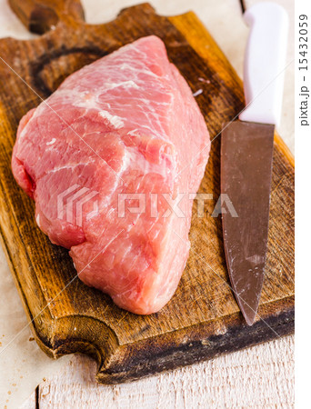raw meat on a cutting board on a white background raw meat on a cutting board on a white background 15432059