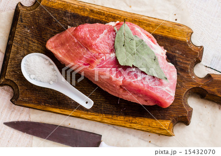raw meat on a cutting board on a white background raw meat on a cutting board on a white background 15432070