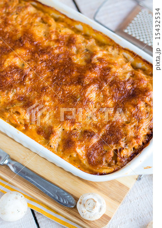 meat lasagna with mushrooms in a white bowl  15432534
