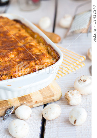 meat lasagna with mushrooms in a white bowl  15432547