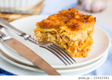 piece of meat lasagna with mushrooms on a plate 15432581