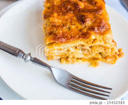 piece of meat lasagna with mushrooms on a plate 15432583