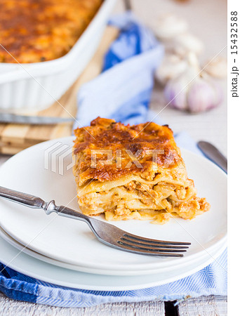 piece of meat lasagna with mushrooms on a plate 15432588