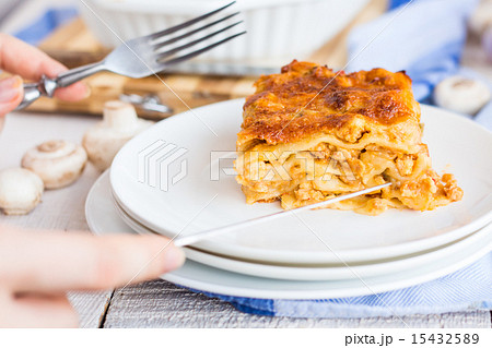 piece of meat lasagna with mushrooms on a plate piece of meat lasagna with mushrooms on a plate 15432589