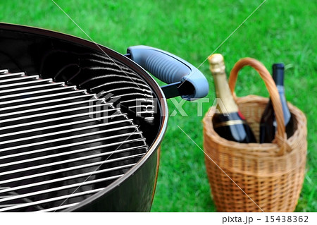 BBQ Grill On The Lawn And Basket With Champagne BBQ Grill On The Lawn And Basket With Champagne 15438362