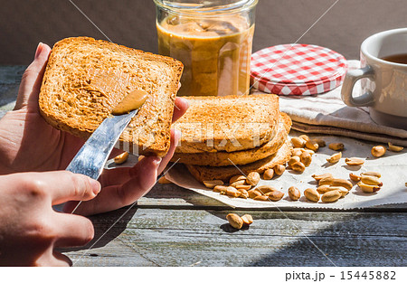 add to ruddy toast peanut butter, hand, breakfast 15445882