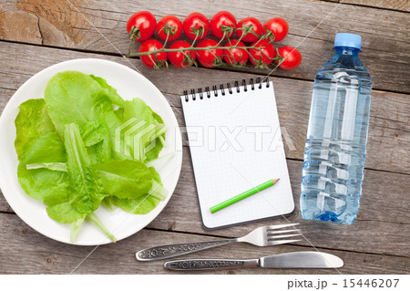 Fresh healthy salad, tomatoes, water bottle  15446207