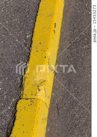Yellow curb stone border 15453273