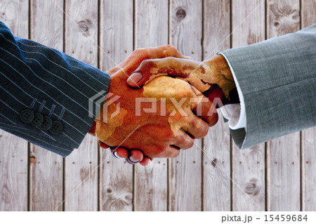Composite image of business people shaking hands Composite image of business people shaking hands 15459684