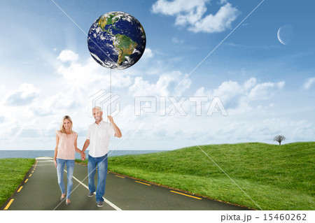 Composite image of happy couple walking holding hands 15460262