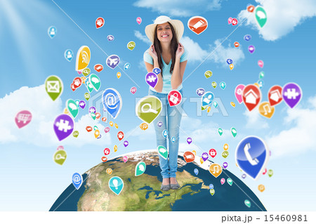 Composite image of happy young brunette wearing sunhat 15460981