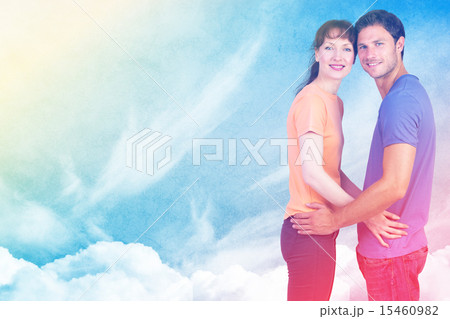 Composite image of couple looking at the camera 15460982