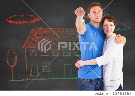 Composite image of couple holding keys to home Composite image of couple holding keys to home 15461167