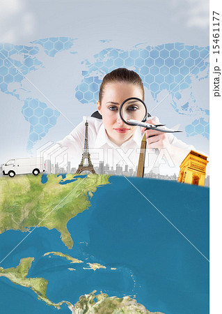 Composite image of businesswoman typing and looking through magn 15461177