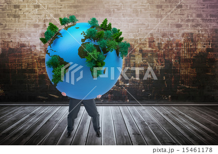 Composite image of businessman carrying the world 15461178