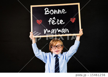 Composite image of cute pupil holding chalkboard Composite image of cute pupil holding chalkboard 15461256