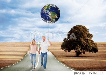 Composite image of happy couple walking holding hands Composite image of happy couple walking holding hands 15461333