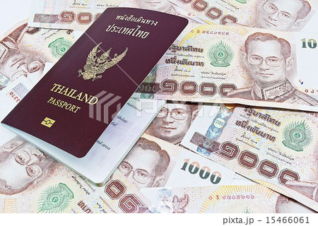 Thailand passport with Thai money ready to travel Thailand passport with Thai money ready to travel 15466061