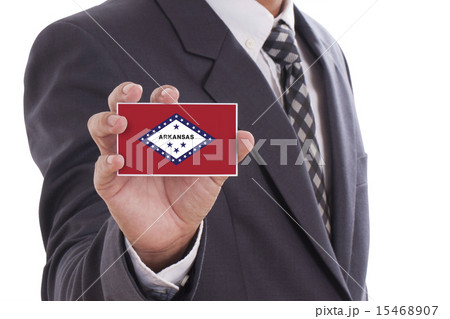 Businessman hand showing Arkansas Flag  15468907