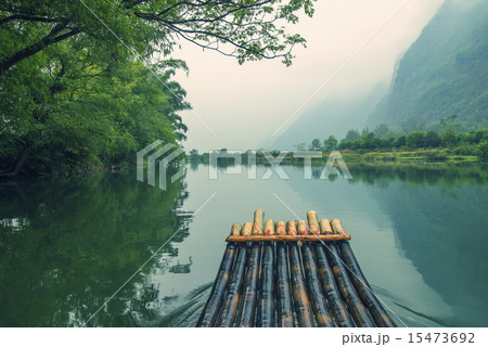 China Guilin Yangshuo bamboo rafting in the beautiful "Yulong River" 15473692