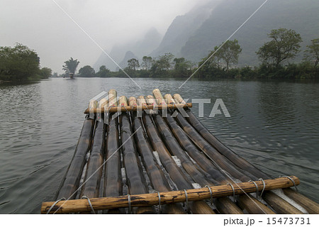 China Guilin Yangshuo bamboo rafting in the beautiful "Yulong River" China Guilin Yangshuo bamboo rafting in the beautiful "Yulong River" 15473731