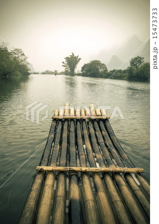 China Guilin Yangshuo bamboo rafting in the beautiful "Yulong River" retro colors. China Guilin Yangshuo bamboo rafting in the beautiful "Yulong River" retro colors. 15473733