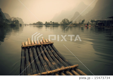China Guilin Yangshuo bamboo rafting in the beautiful "Yulong River" China Guilin Yangshuo bamboo rafting in the beautiful "Yulong River" 15473734
