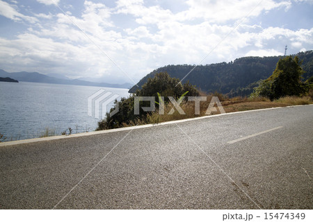 Quiet lakeside road Quiet lakeside road 15474349