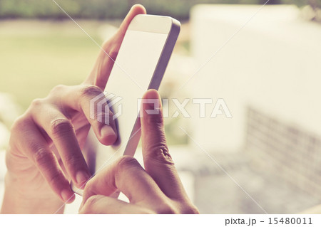 Woman Using a Smart Phone 15480011