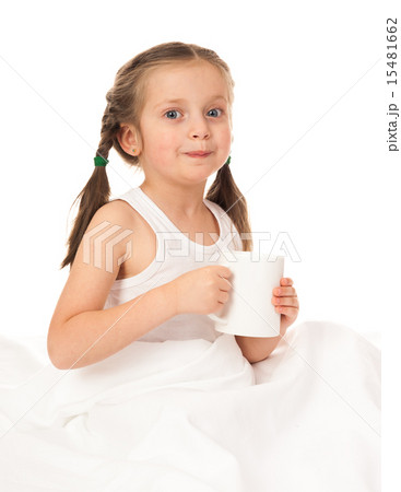 girl with cup in white bed 15481662