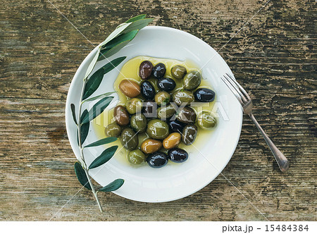 A plate of Mediterranean olives in olive oil A plate of Mediterranean olives in olive oil 15484384