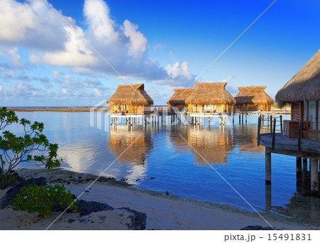 The coast and lodges on water at sunrise 15491831