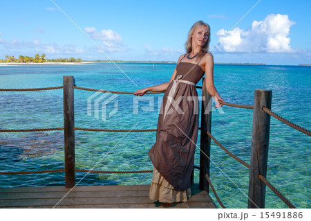 The young beautiful woman  on a wooden platform  15491886