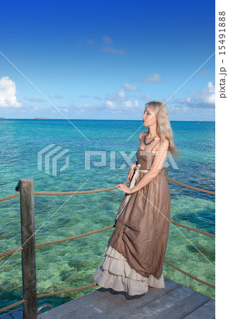 beautiful woman on a wooden scaffold over the sea 15491888