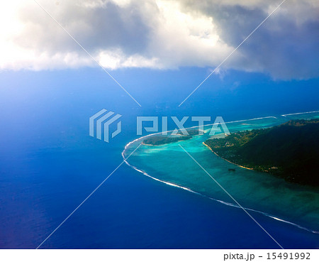 Polynesia. The atoll in ocean through clouds.  Polynesia. The atoll in ocean through clouds.  15491992