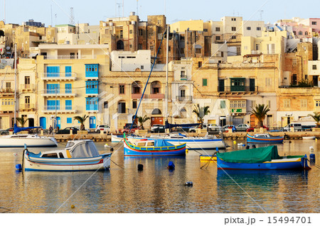 The view on traditional Maltese boats in sunset 15494701