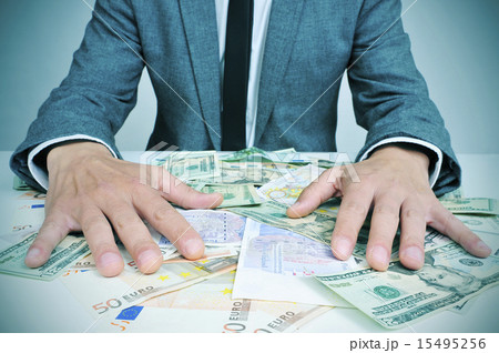 man in suit with dollar and euro bills man in suit with dollar and euro bills 15495256