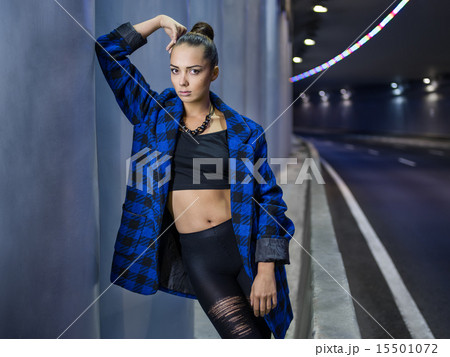 attractive girl with a blue coat 15501072