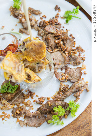 Fried pork with garlic and omelet on stick Fried pork with garlic and omelet on stick 15509547