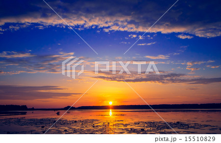 Amazing sunset over lake 15510829