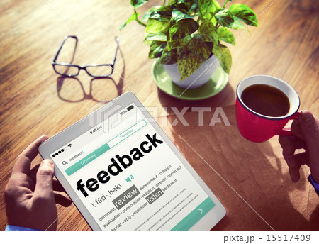 Man Reading the Definition of Feedback 15517409