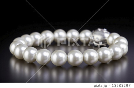 White pearls necklace on black White pearls necklace on black 15535297