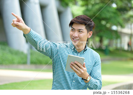 Chinese student pointing using iPad 15536268