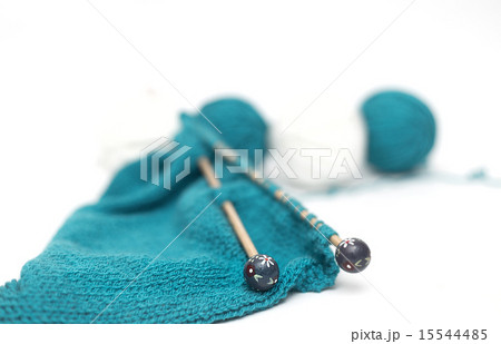 blue yarn knitted fabric, knitting spokes close-up blue yarn knitted fabric, knitting spokes close-up 15544485