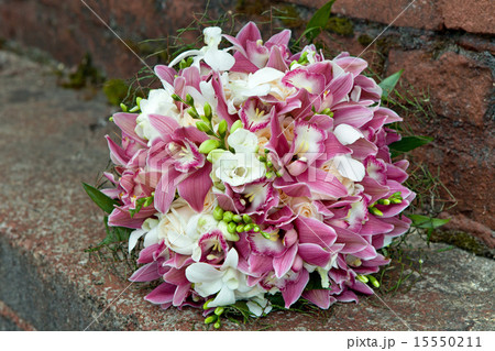 Bouquet from orchids, roses, irises  15550211