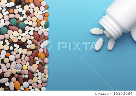 Different pills and bottle with copy space 15553634