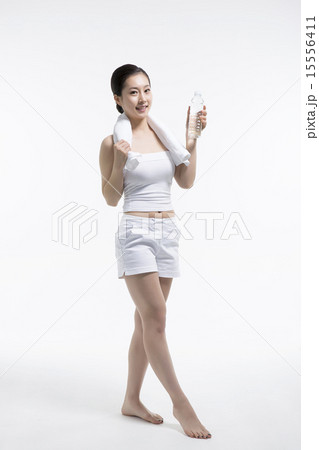 Beautiful woman cares of the skin face isolated on white background Beautiful woman cares of the skin face isolated on white background 15556411