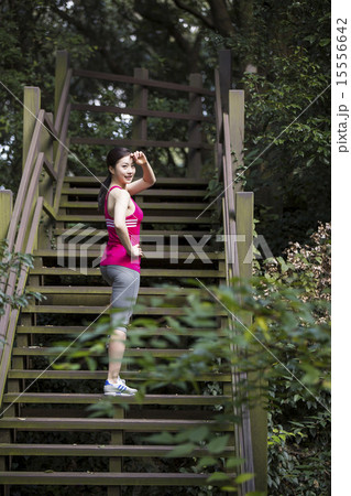 Asian woman having outdoor fintenss sport training Asian woman having outdoor fintenss sport training 15556642